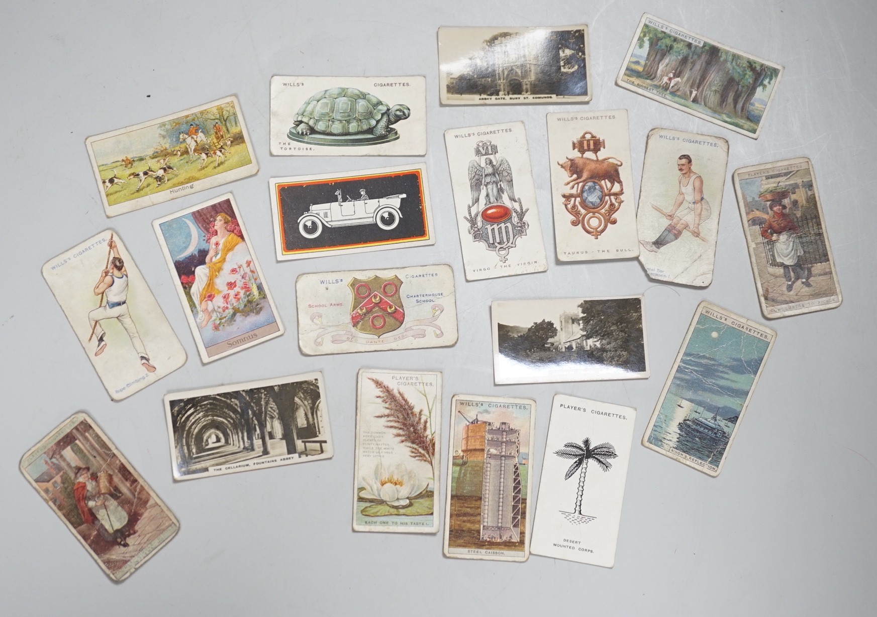 A large collection of mounted and loose cigarette cards